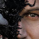Poster of Venom: Let There Be Carnage showing Tom Hardy and Venom's faces split down the middle.